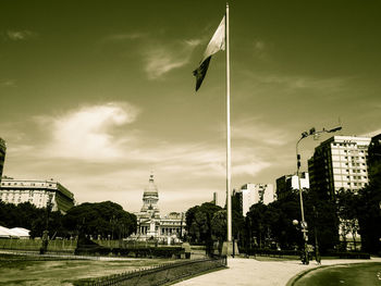 View of modern building against cloudy sky