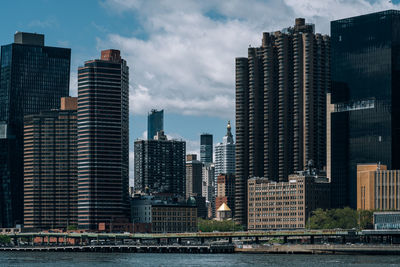 Modern buildings in city against sky