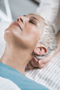 Close-up of woman getting massage at spa