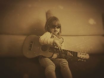 Girl playing with guitar