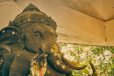 Low angle view of buddha statue