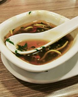 Close-up of serving soup in bowl