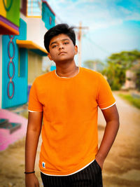 Portrait of teenage boy standing outdoors