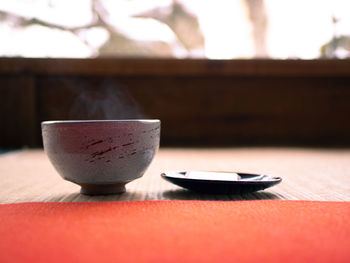 Close-up of tea cup on table