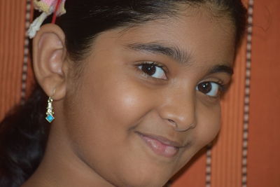 Close-up portrait of smiling girl