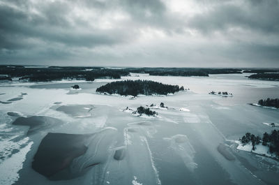 Scenic view of frozen lake against sky