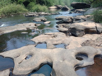 High angle view of rocks by lake