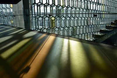 Close-up of metal fence on table