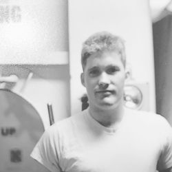 Portrait of young man at home