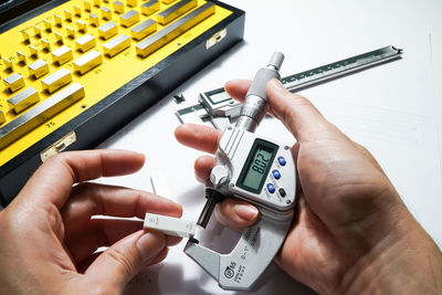 High angle view of person working on table