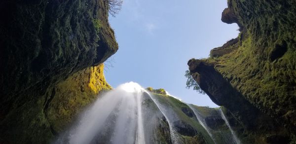 Panoramic view of waterfall against sky