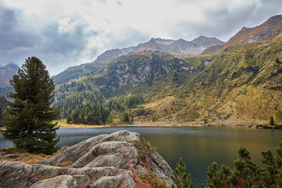 Scenic view of lake and mountains against sky