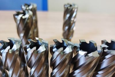 Close-up of objects on table against wall