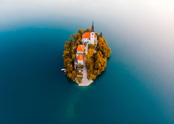 High angle view of sea against blue sky