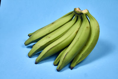 High angle view of bananas against blue background