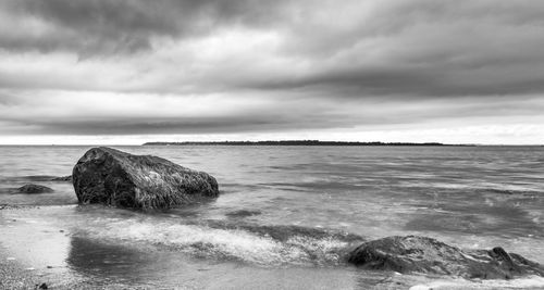 Scenic view of sea against cloudy sky