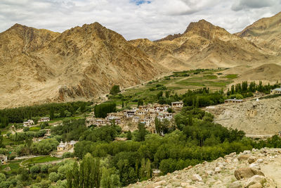 Scenic view of landscape and mountains against sky