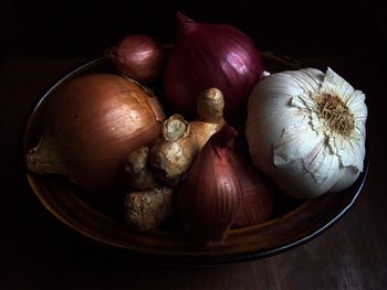 Close-up of vegetables on table against black background