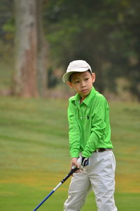 Boy playing golf