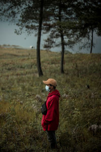 Rear view of boy walking on land