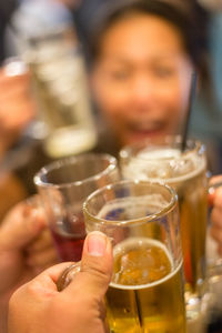 Close-up of hand holding drink