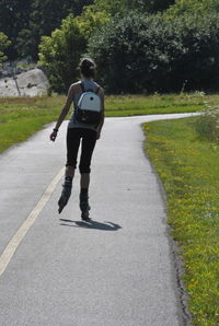 Full length of man walking on road