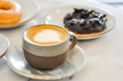 Close-up of cappuccino served on table