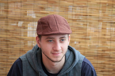 Portrait of young man wearing hat during winter