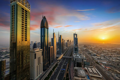 Cityscape against sky during sunset