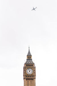 Low angle view of clock tower against sky