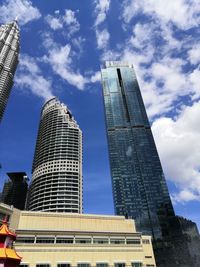 Low angle view of modern buildings against sky