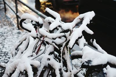 Close-up of frozen bicycles