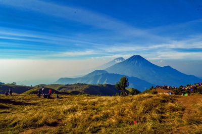 Scenic view of landscape against cloudy sky