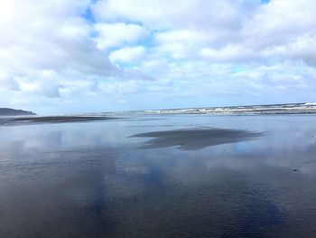 Scenic view of beach against sky