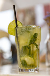 Close-up of lemon drink served on table