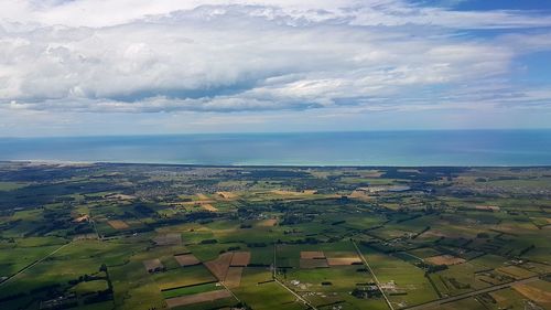 Aerial view of agricultural landscape against sky