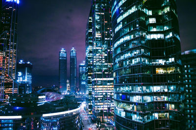 Illuminated buildings in city at night