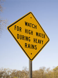 Close-up of road sign against clear sky