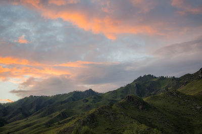Scenic view of mountains against sky during sunset