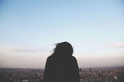 Woman looking at cityscape