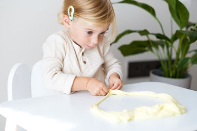 Girl drawing on book