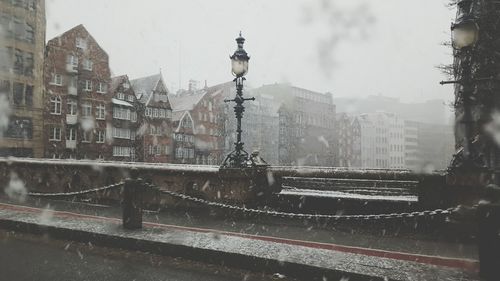 Buildings in city against sky