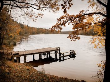 Scenic view of lake against sky during autumn