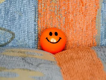 Close-up of pumpkin face on stone wall during halloween