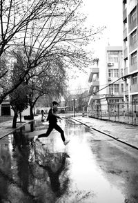 Woman jumping in city