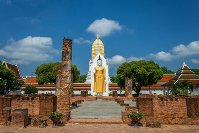 Exterior of temple against building and sky