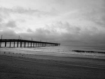 Pier over sea against sky