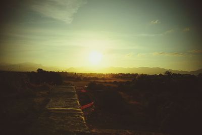 Landscape against sky during sunset