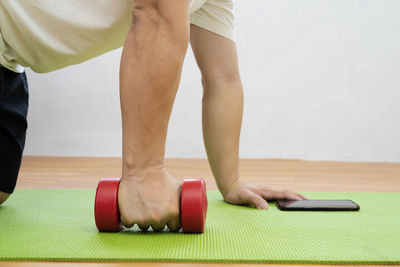 Low section of man standing on floor