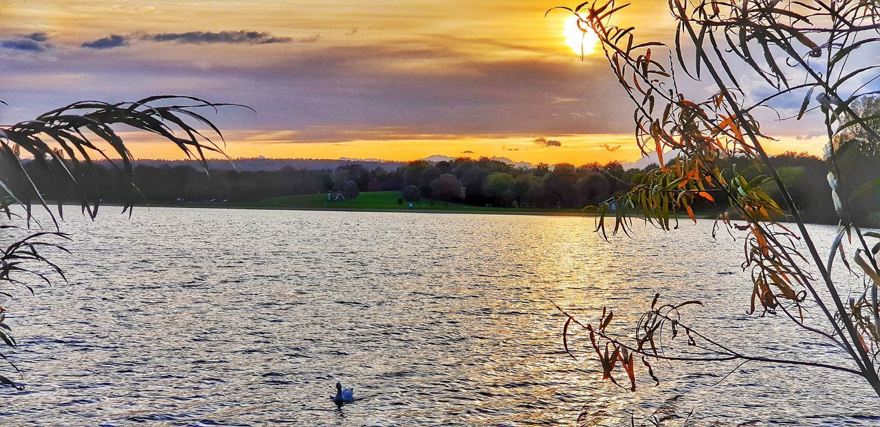 SCENIC VIEW OF LAKE DURING SUNSET